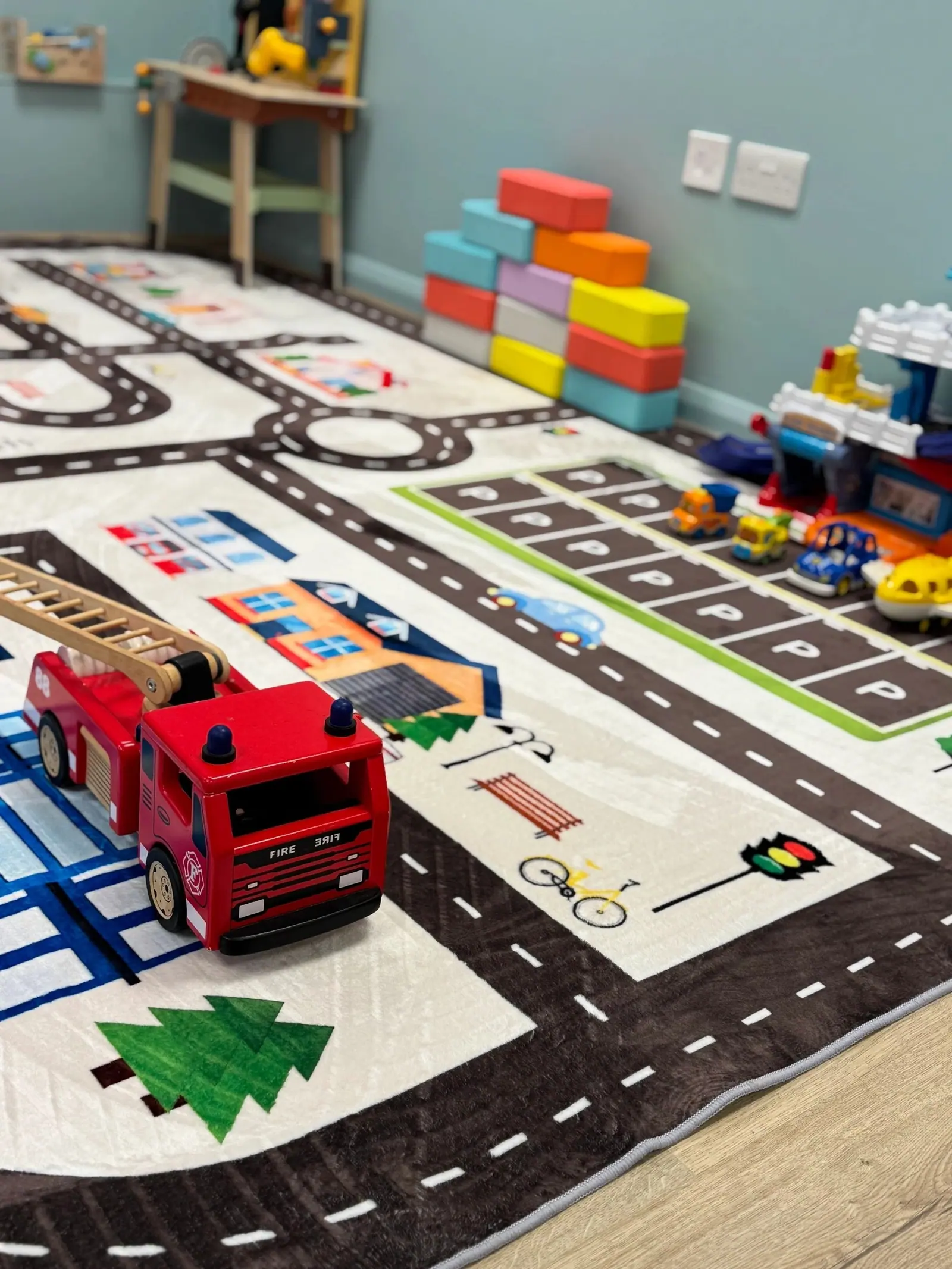 Road play mat with fire engine, bricks and vehicles